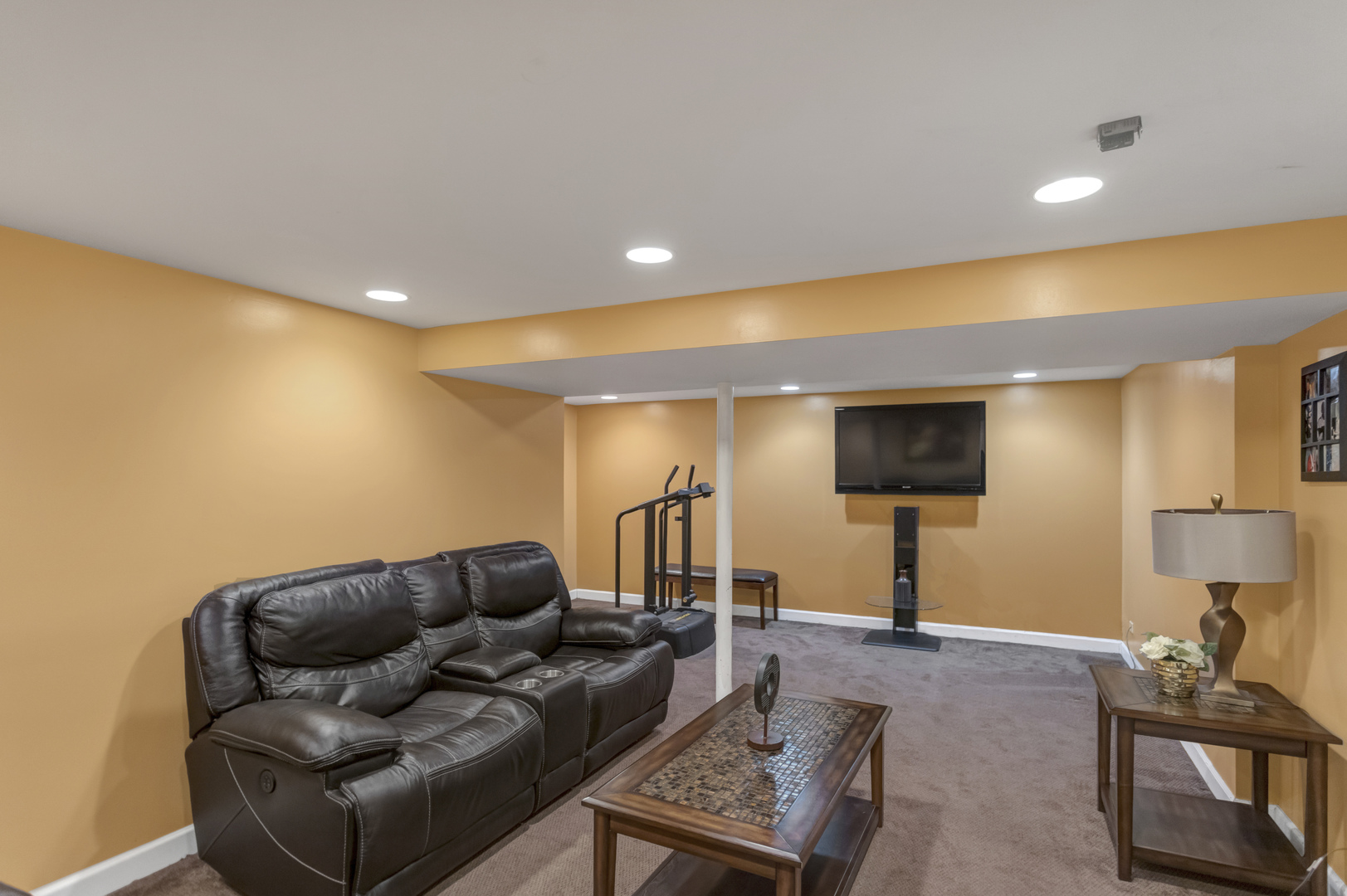507 Monroe Road Bolingbrook, IL 60440 - Photo 22 of 29 a living room with furniture and a flat screen tv