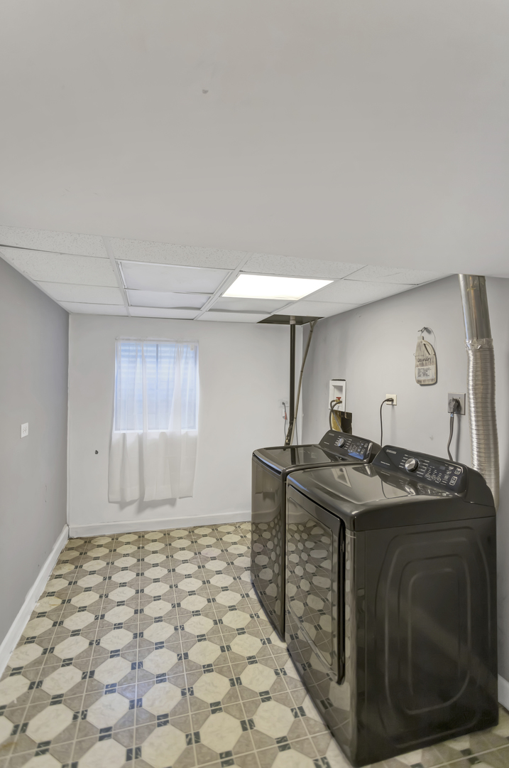 507 Monroe Road Bolingbrook, IL 60440 - Photo 25 of 29 a kitchen with stainless steel appliances granite countertop a sink and a stove