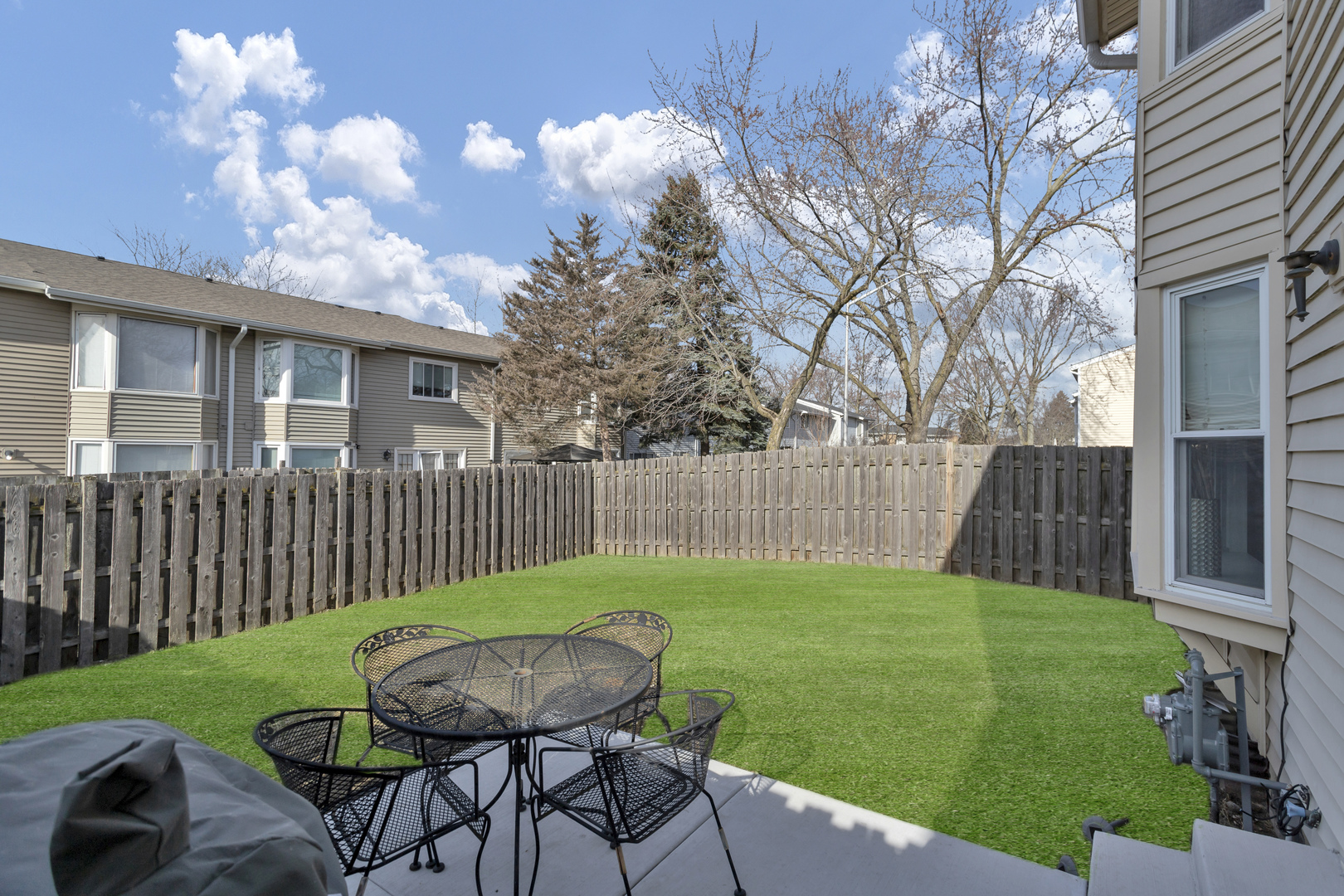 507 Monroe Road Bolingbrook, IL 60440 - Photo 27 of 29 a view of a chair and table in backyard front of house