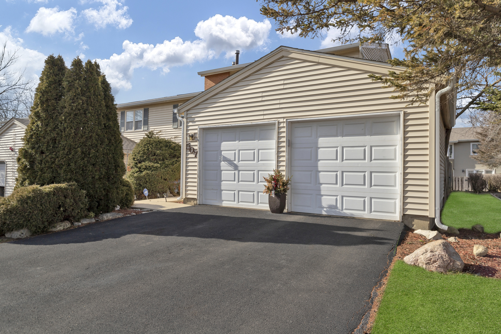 507 Monroe Road Bolingbrook, IL 60440 - Photo 28 of 29 a front view of a house with a yard and garage