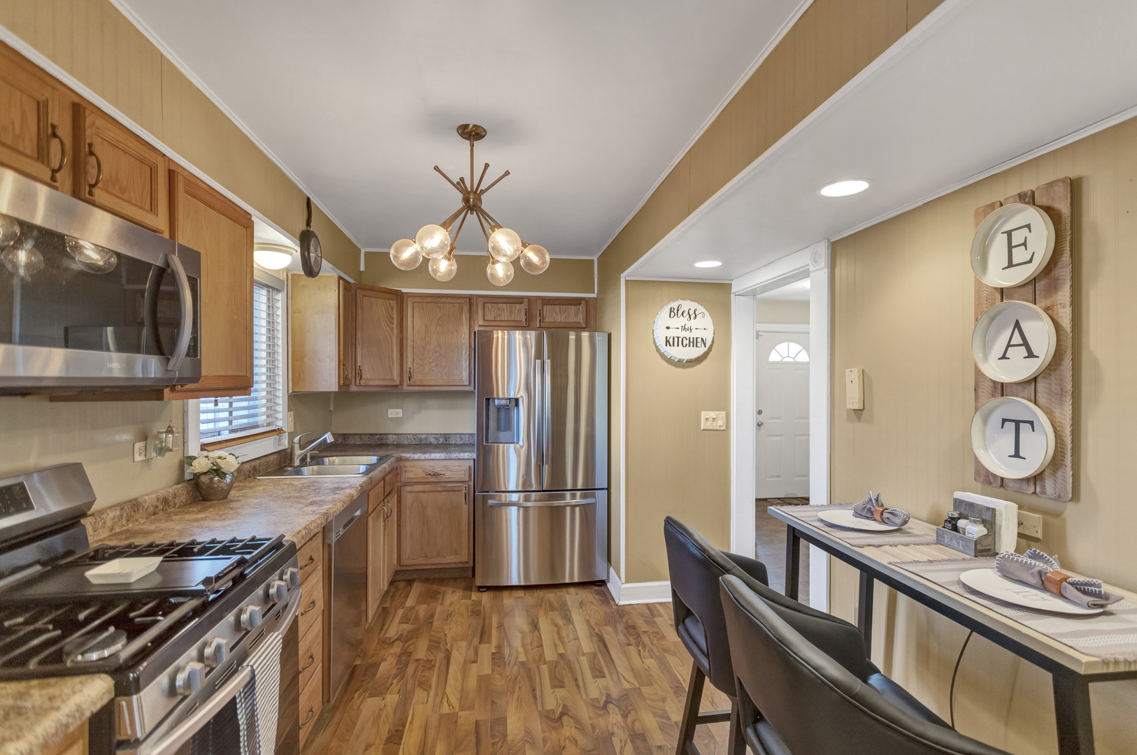 507 Monroe Road Bolingbrook, IL 60440 - Photo 8 of 29 a kitchen with stainless steel appliances granite countertop a stove and a refrigerator