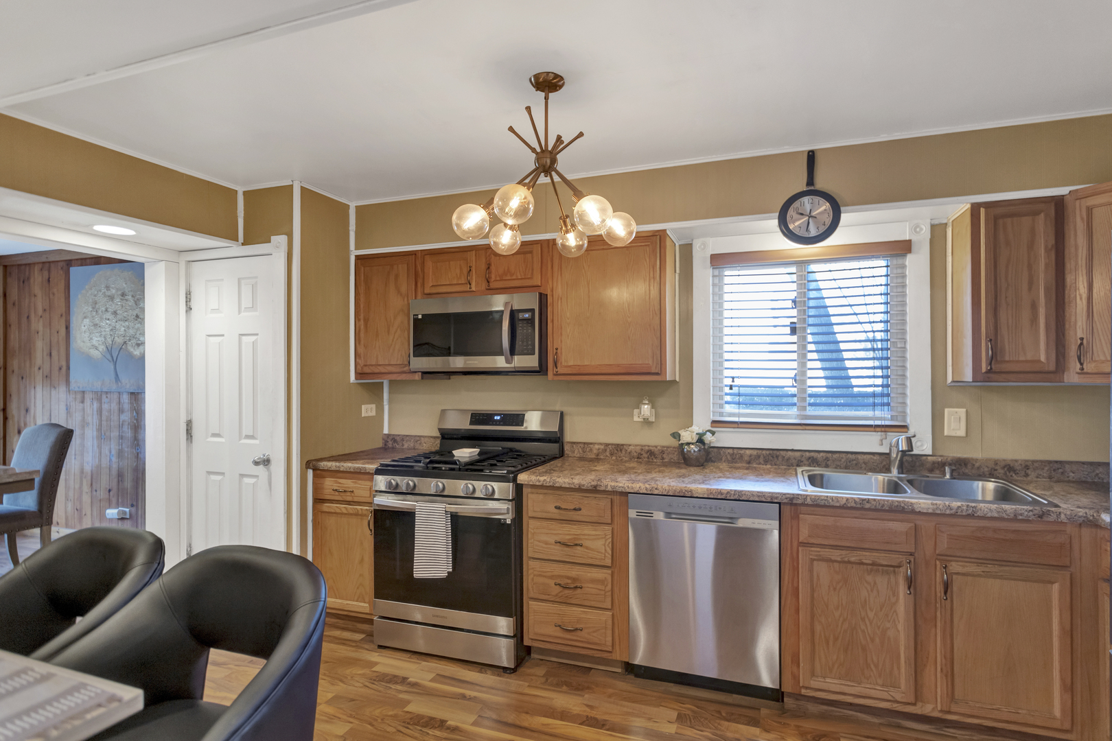 507 Monroe Road Bolingbrook, IL 60440 - Photo 10 of 29 a kitchen with stainless steel appliances granite countertop a stove a sink and a microwave