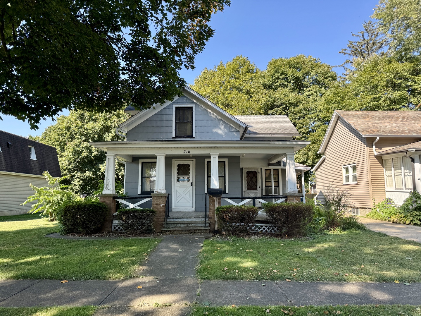 210 North Church Street Princeton, IL 61356 - Photo 2 of 20 a front view of a house with a garden