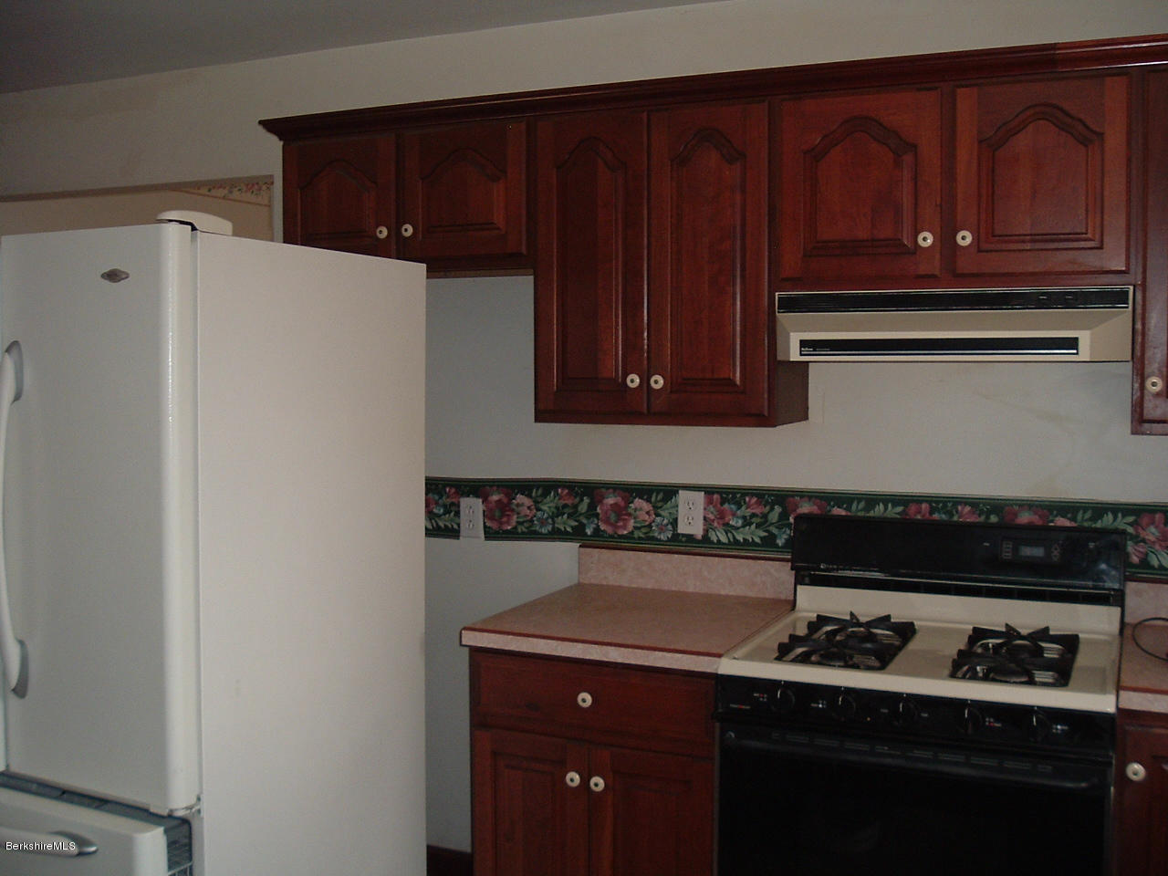 102 East Main Road Peru, MA 01235 - Photo 2 of 21 a kitchen with a sink a stove and cabinets