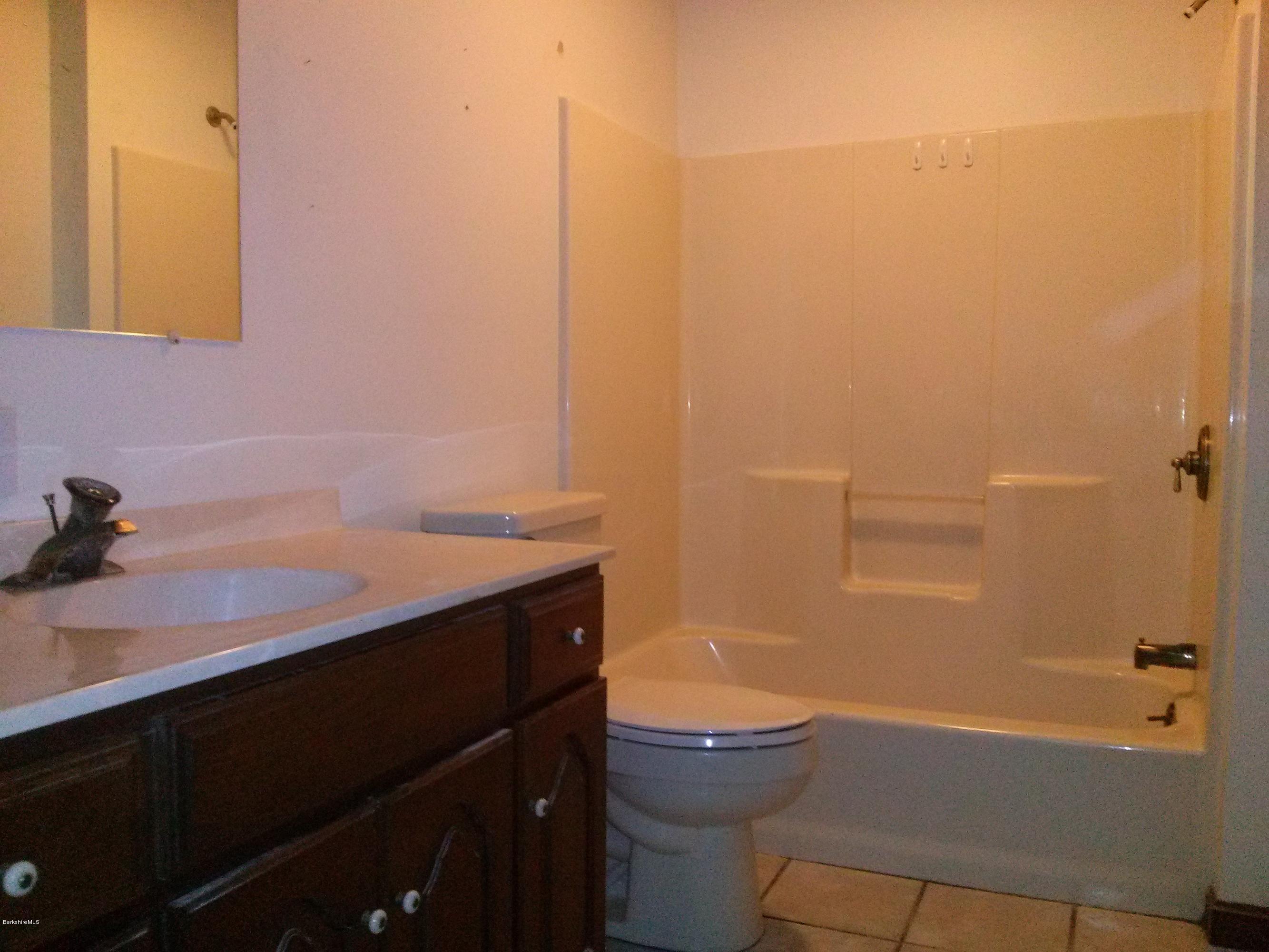 102 East Main Road Peru, MA 01235 - Photo 11 of 21 a bathroom with a sink a toilet and shower