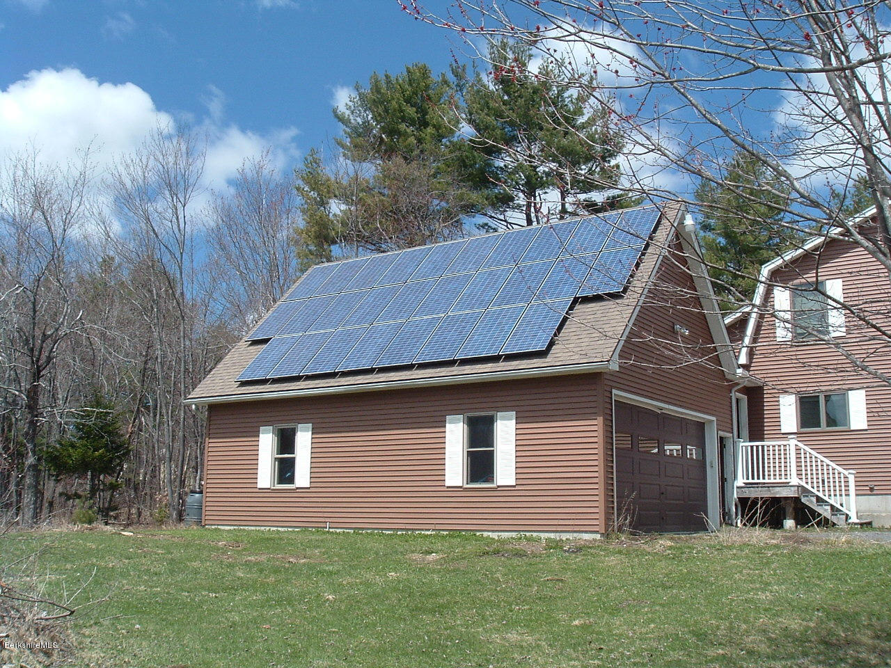 102 East Main Road Peru, MA 01235 - Photo 14 of 21 a aerial view of a house next to a yard