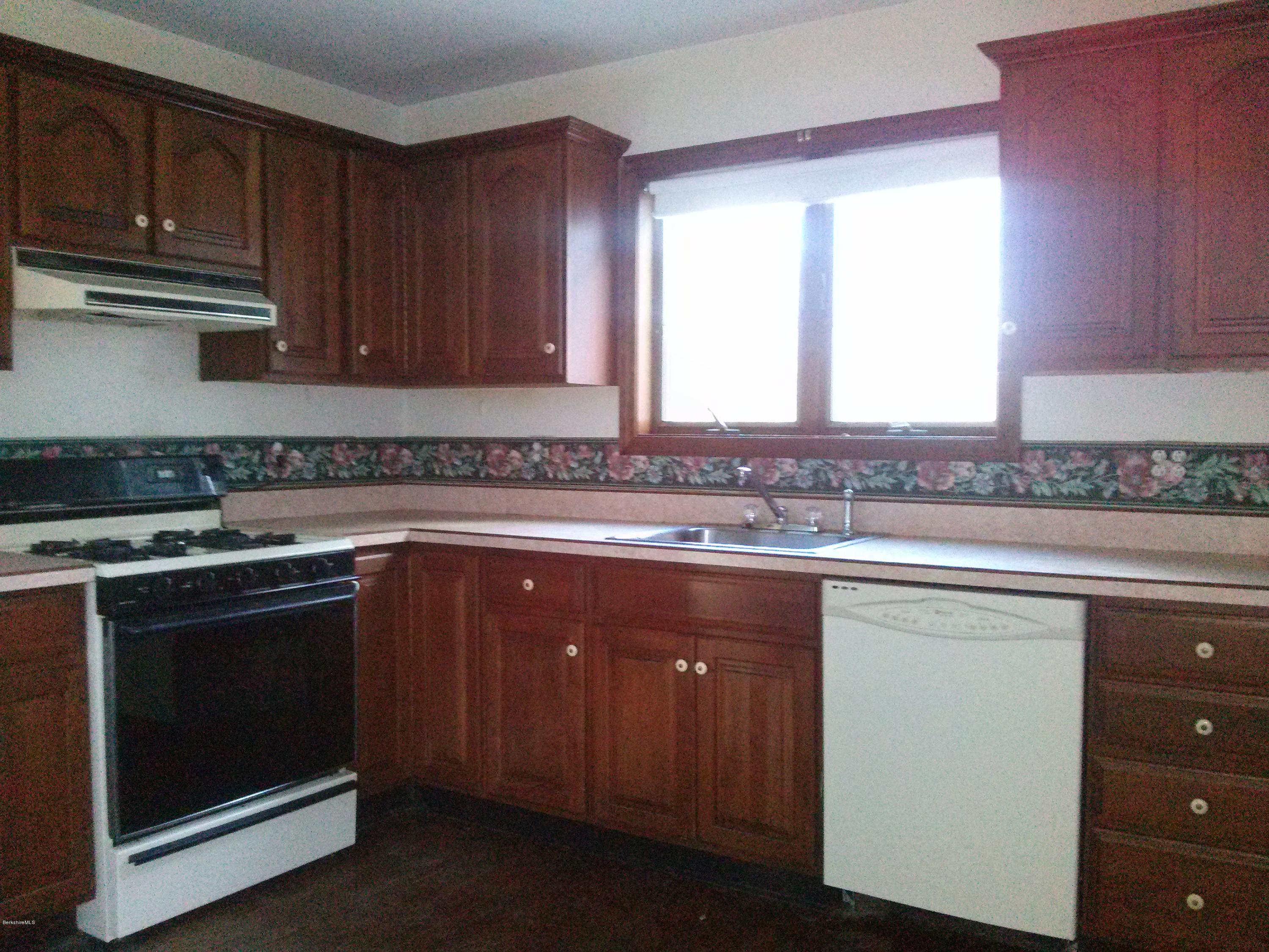 102 East Main Road Peru, MA 01235 - Photo 3 of 21 a kitchen with stainless steel appliances granite countertop a stove a sink and a microwave