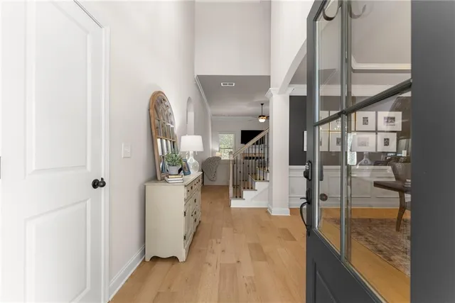 a large kitchen with a table and chairs