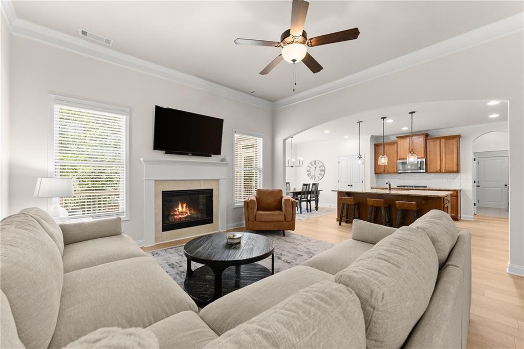 8055 Veranda Curve Ball Ground, GA 30107 - Photo 2 of 65 a living room with furniture fireplace and flat screen tv