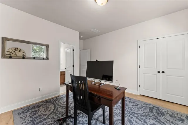 a white bath tub sitting in a bathroom next to a window