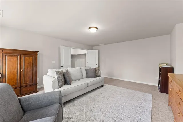 a view of a chair and tables in the balcony