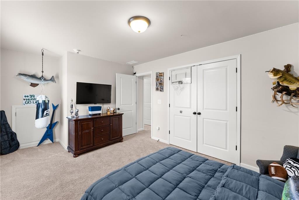 8055 Veranda Curve Ball Ground, GA 30107 - Photo 44 of 65 a room with furniture and flat screen tv