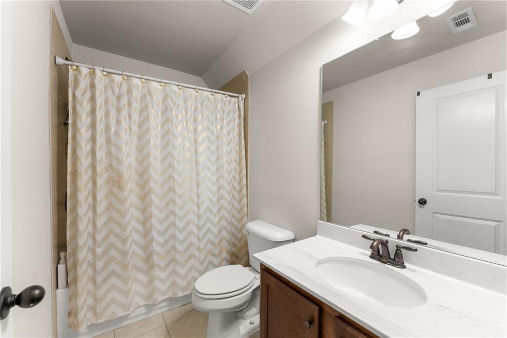 8055 Veranda Curve Ball Ground, GA 30107 - Photo 47 of 65 a bathroom with a sink toilet and shower