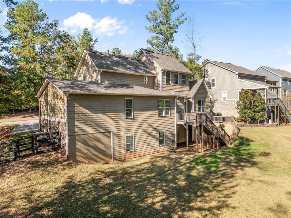 8055 Veranda Curve Ball Ground, GA 30107 - Photo 56 of 65 front view of a house with a yard