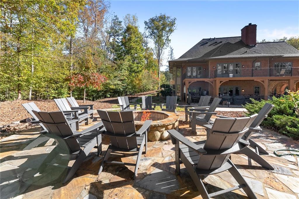 8055 Veranda Curve Ball Ground, GA 30107 - Photo 8 of 65 a view of a patio with table and chairs and potted plants