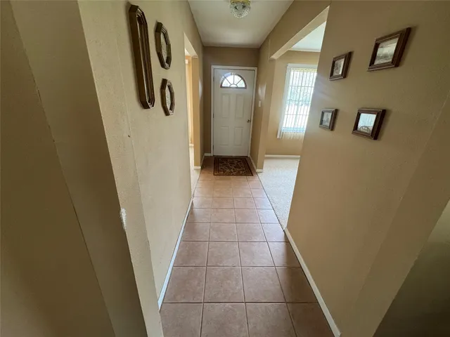 a bedroom with a bed couch and a window