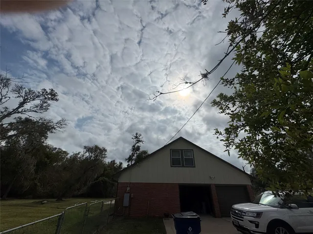 a big yard with lots of green space and house