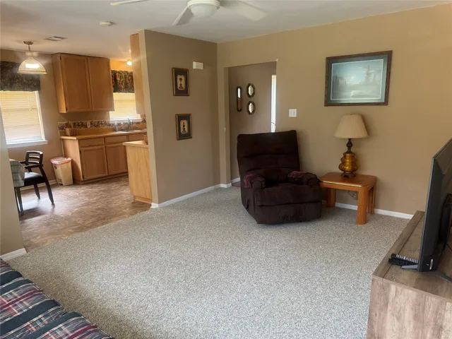 a room with furniture and a flat screen tv