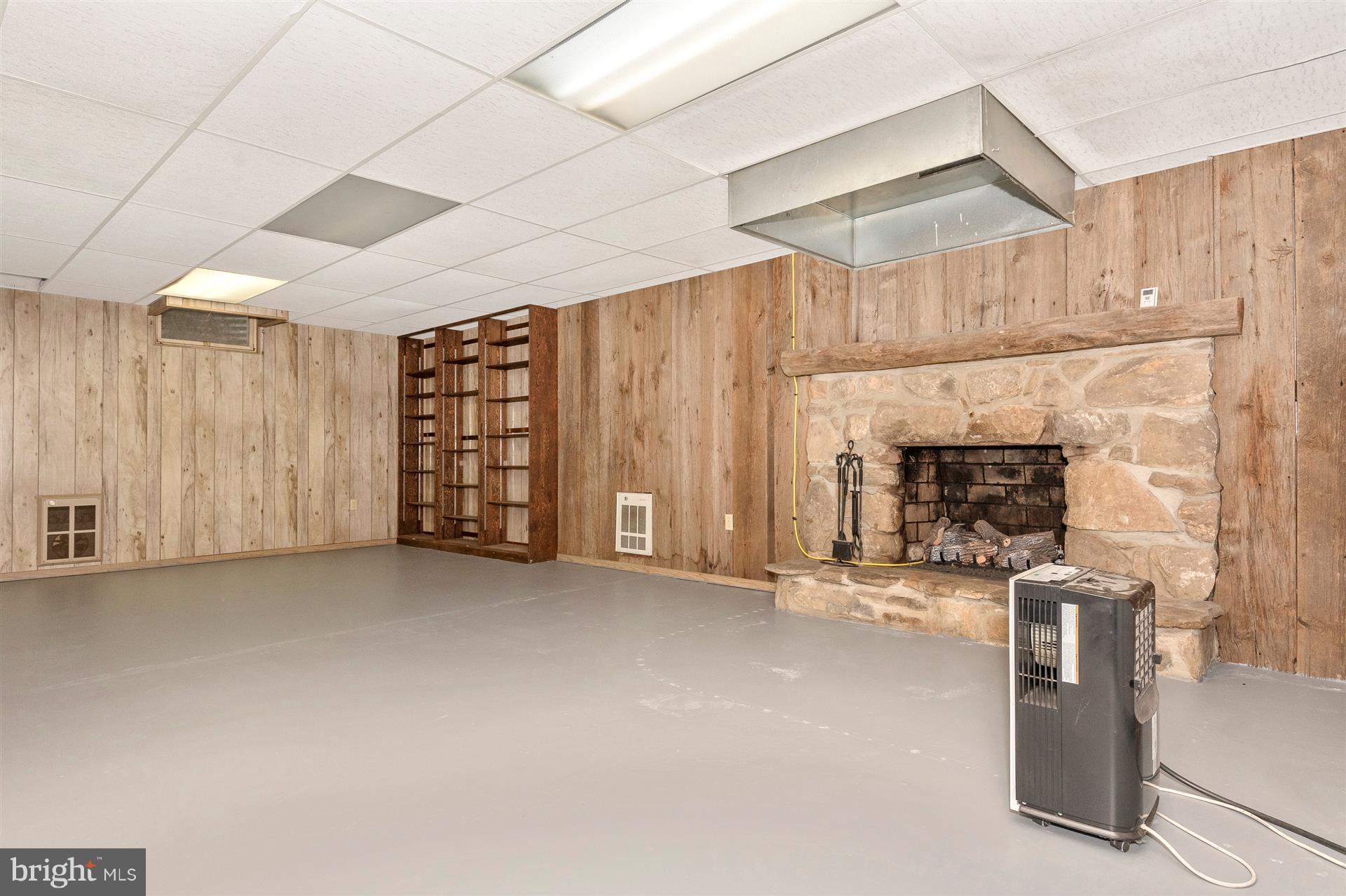 8134 Mountain Laurel Road Boonsboro, MD 21713 - Photo 25 of 27 rec room in basement with gas fireplace (MAN CAVE