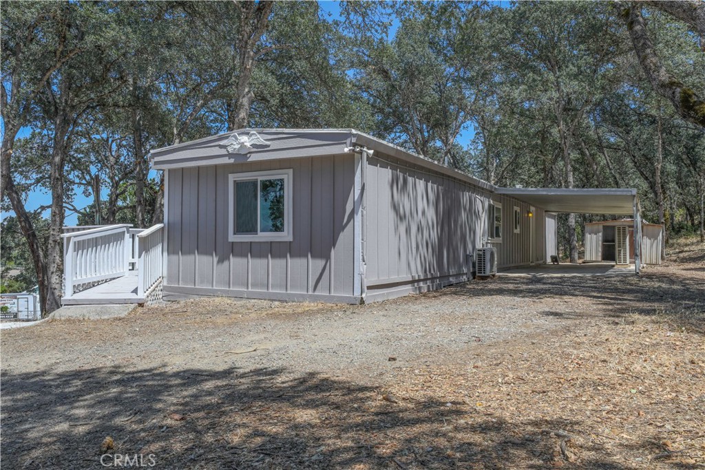 15905 Kugelman Street Lower Lake, CA 95457 - Photo 19 of 75 a view of a house with a yard and garage