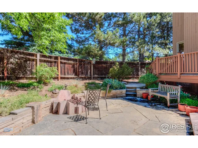 a view of a backyard with sitting area