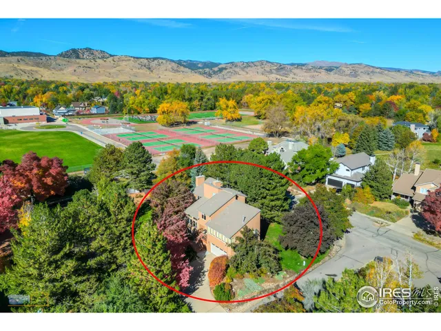 a view of a city with mountains in the background