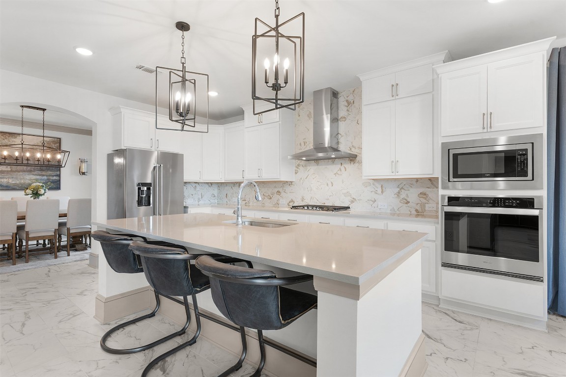 234 Rio Ranchero Road Georgetown, TX 78628 - Photo 17 of 39 Kitchen and Formal Dining Side Entrance