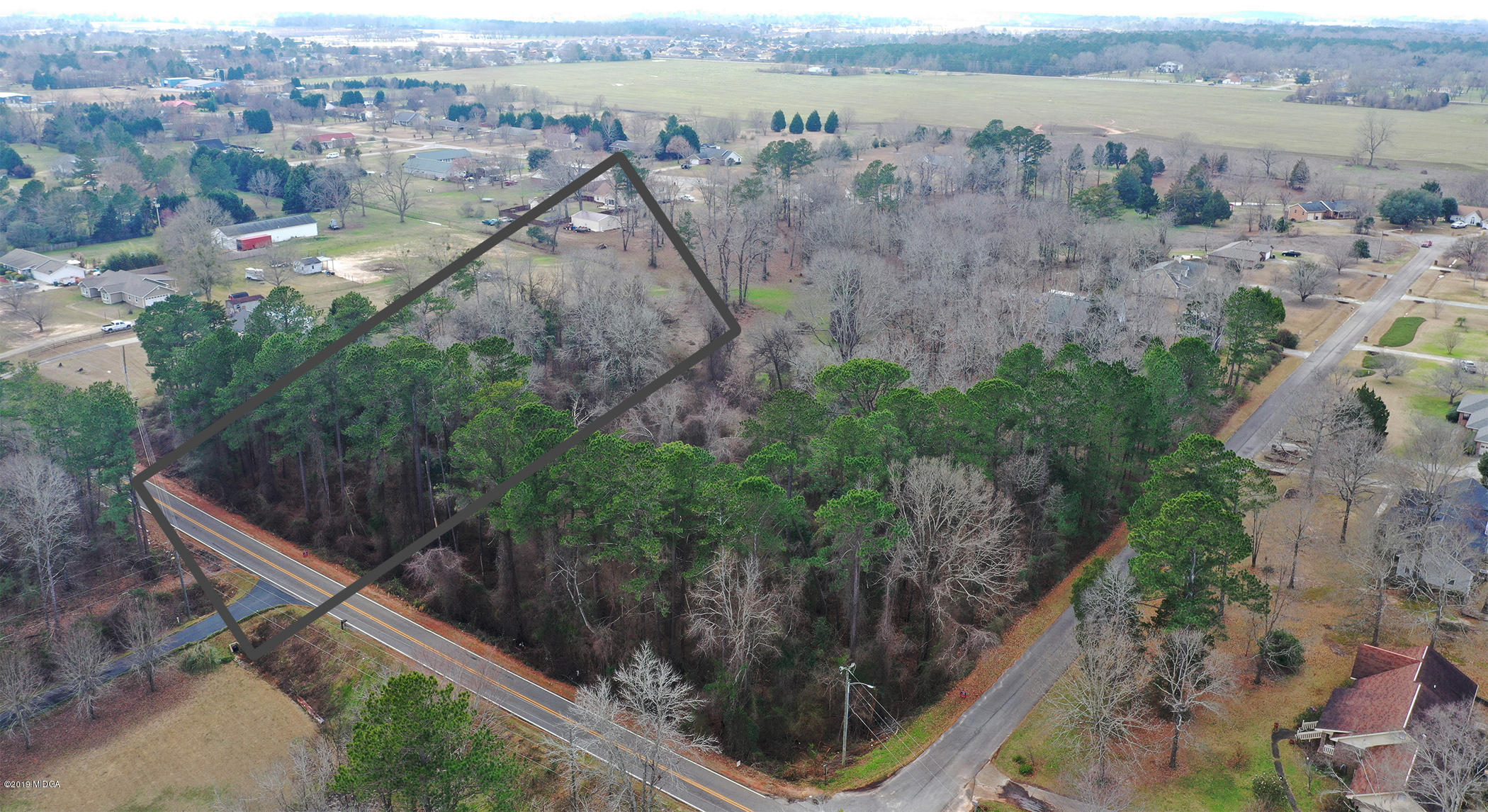 Lot 16 Housers Mill Road Fort Valley, GA 31030 - Photo 3 of 19 an aerial view of house with yard and mountain view in back