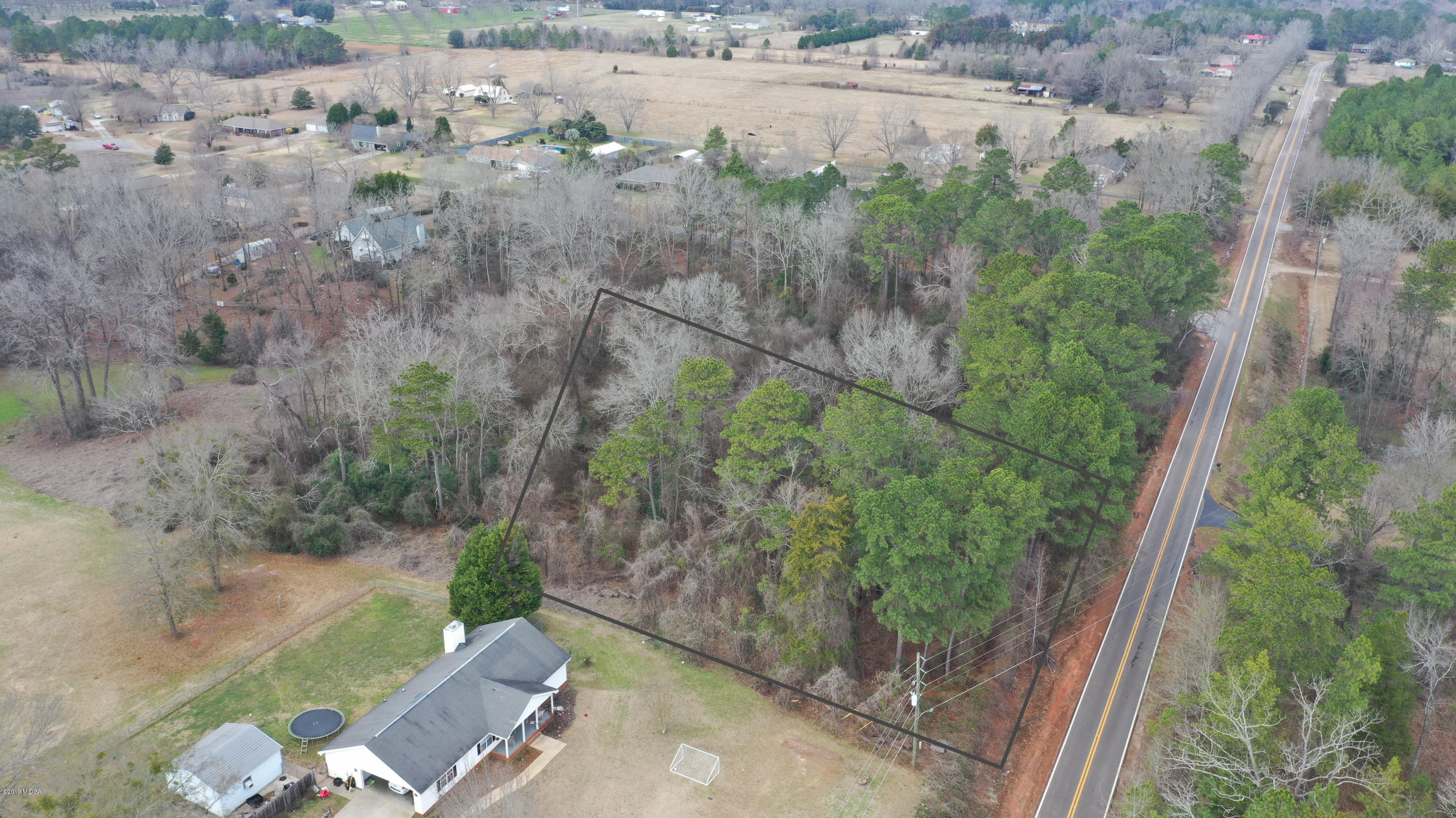 Lot 16 Housers Mill Road Fort Valley, GA 31030 - Photo 6 of 19 an aerial view of a house with a yard