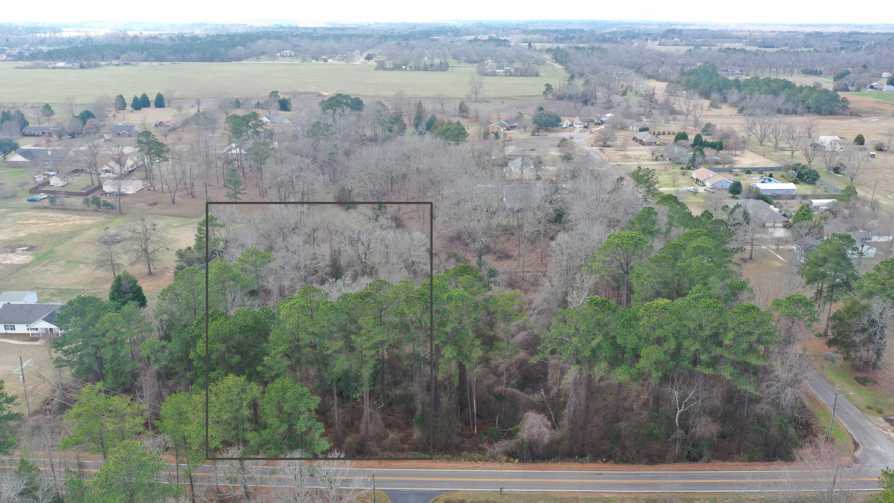 Lot 16 Housers Mill Road Fort Valley, GA 31030 - Photo 10 of 19 an aerial view of a house with a yard and lake view