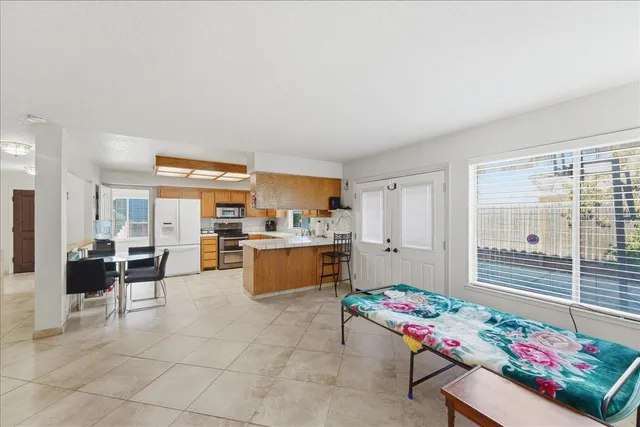 a room with furniture water view and kitchen view