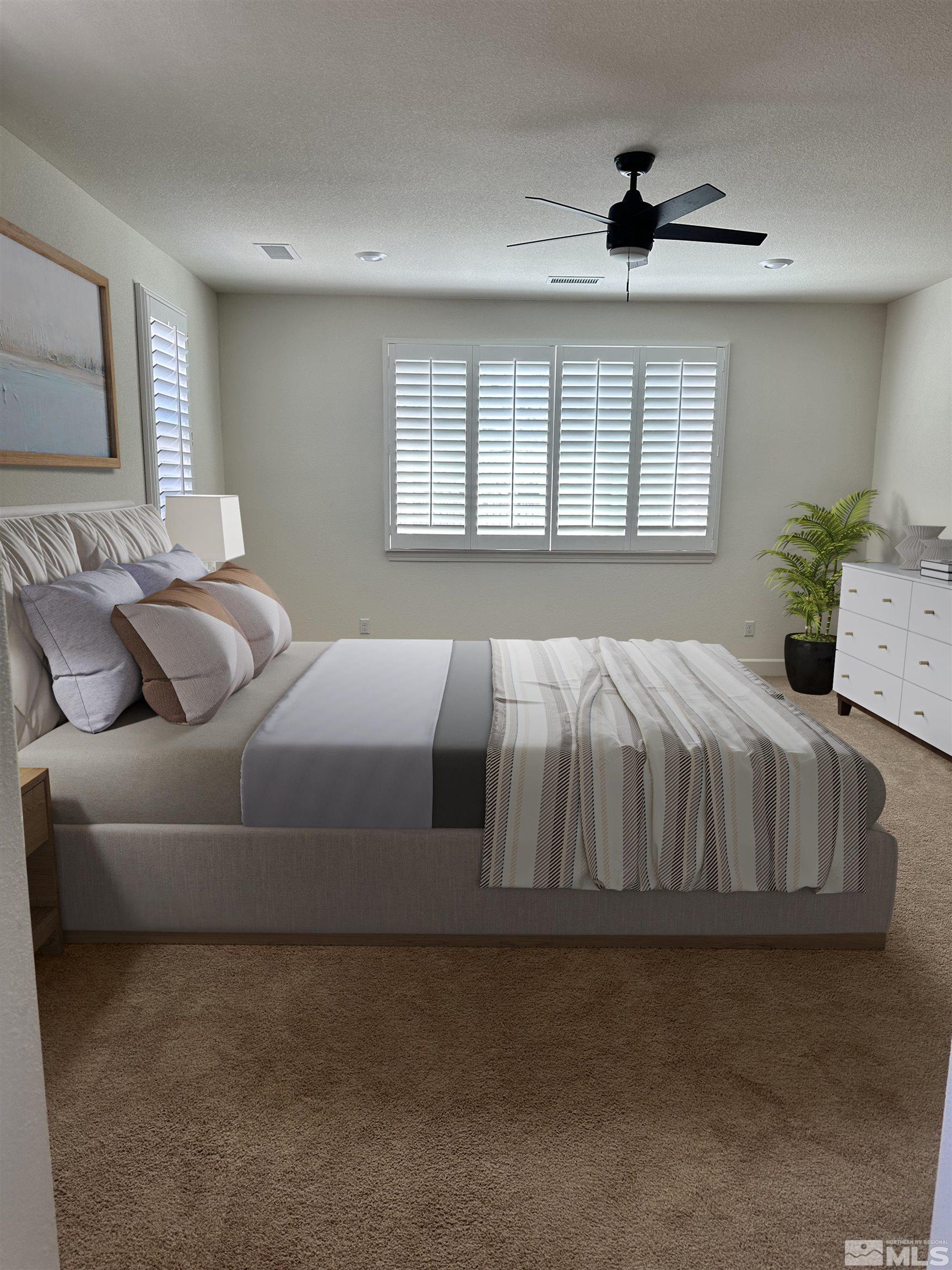 10310 Alchemy Way Reno, NV 89521 - Photo 18 of 30 a bedroom with a bed and window