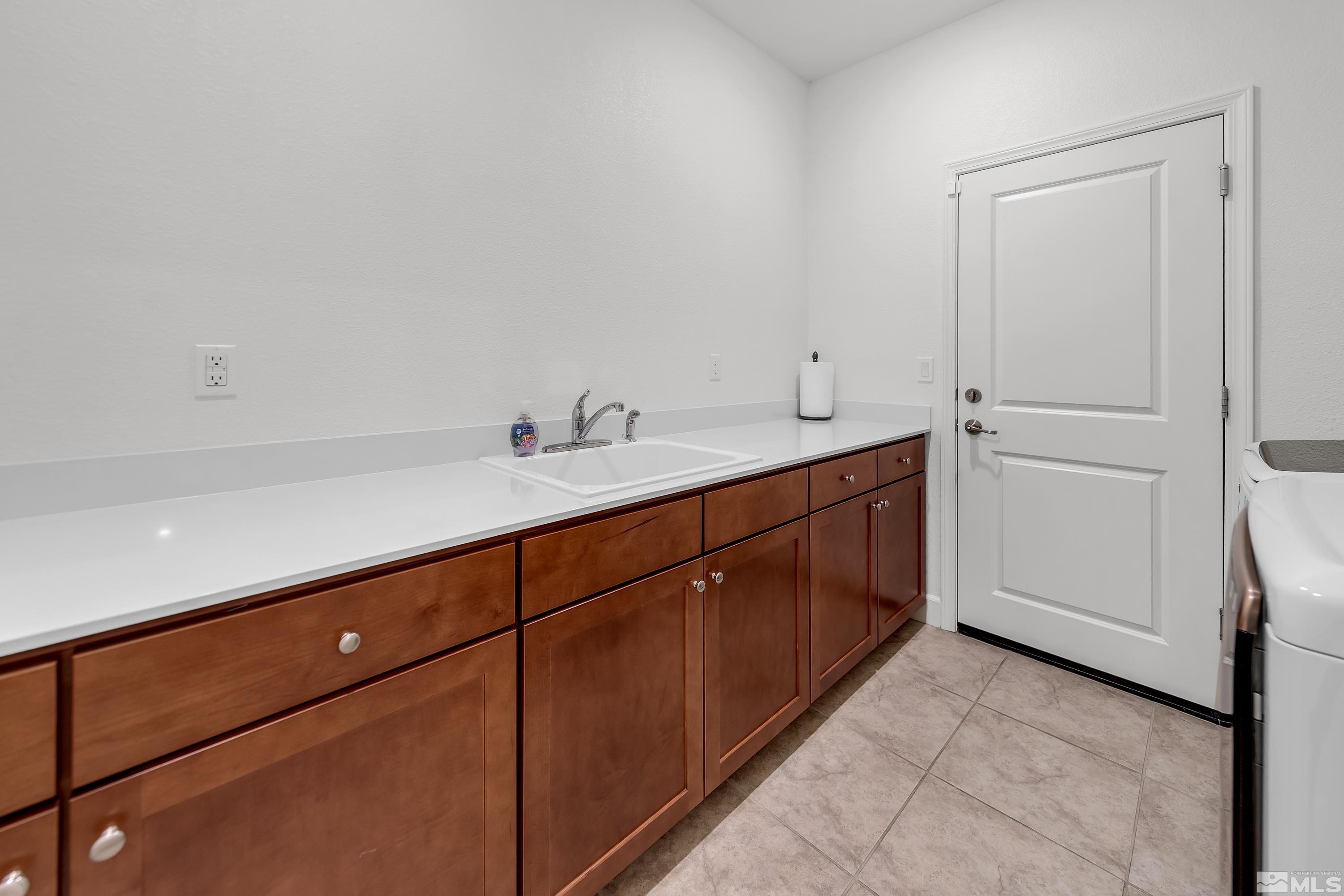 10310 Alchemy Way Reno, NV 89521 - Photo 22 of 30 a spacious bathroom with a double vanity sink and mirror