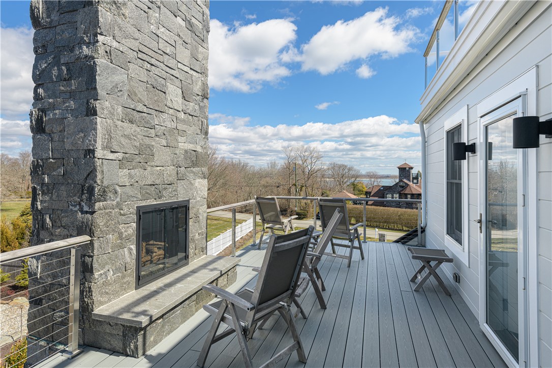 592 Tuckerman Avenue Middletown, RI 02842 - Photo 37 of 50 Third floor deck with fireplace.