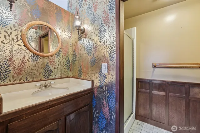 a bathroom with a sink and a mirror