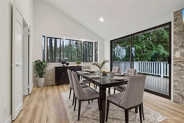 a view of a dining room with furniture window and wooden floor
