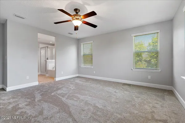 a view of an empty room with a window