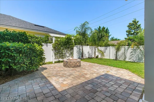 a view of a backyard with garden and plants