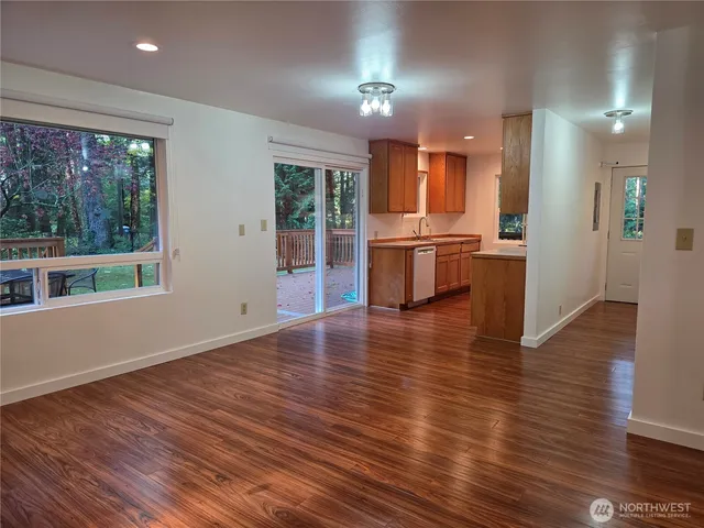 a view of a kitchen with a sink and a large window