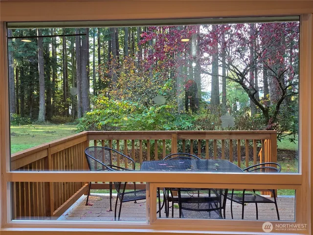 a view of a chairs and table in the balcony