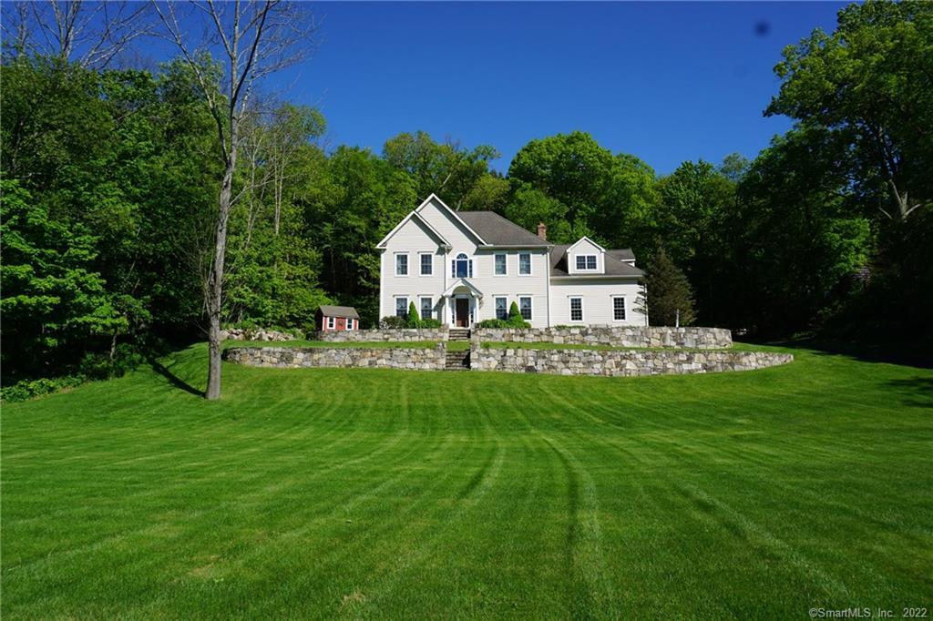 135 Cherry Brook Road Canton, CT 06019 - Photo 1 of 1 a view of a house with a big yard and potted plants