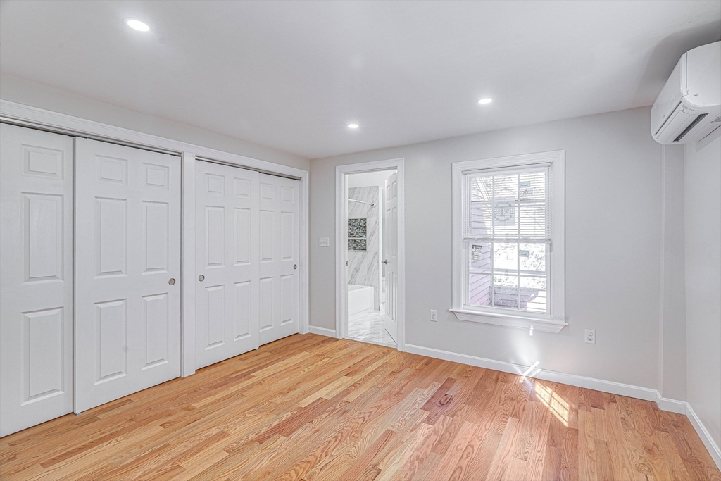 32 Northey Street, Unit 32 Salem, MA 01970 - Photo 13 of 29 a view of empty room with wooden floor and fan