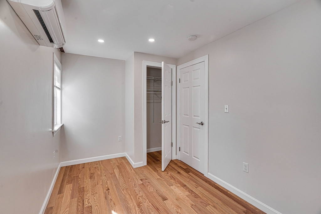 32 Northey Street, Unit 32 Salem, MA 01970 - Photo 19 of 29 a view of empty room with wooden floor and fan