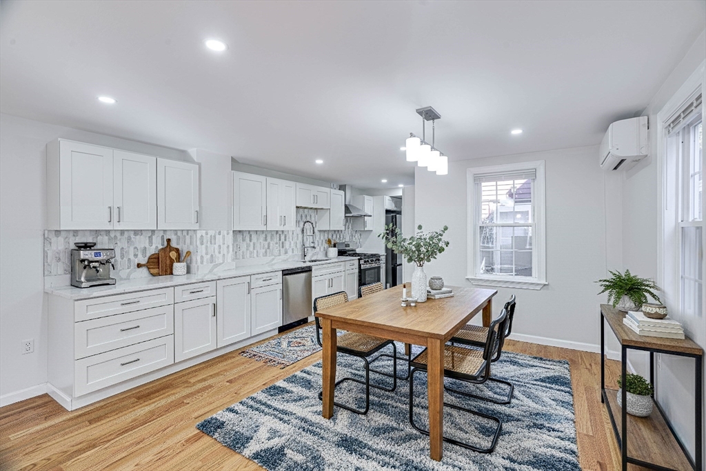 32 Northey Street, Unit 32 Salem, MA 01970 - Photo 2 of 29 a kitchen with a table and chairs in it