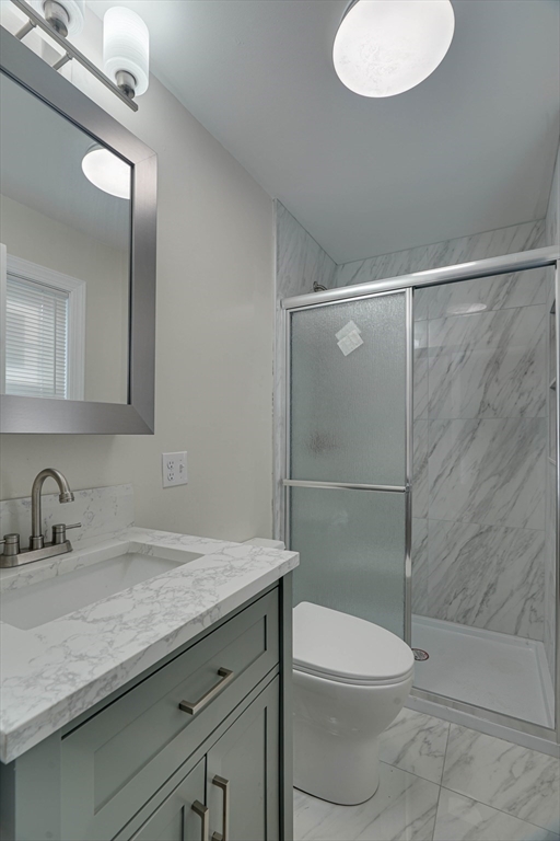 32 Northey Street, Unit 32 Salem, MA 01970 - Photo 22 of 29 a bathroom with a granite countertop sink toilet and shower