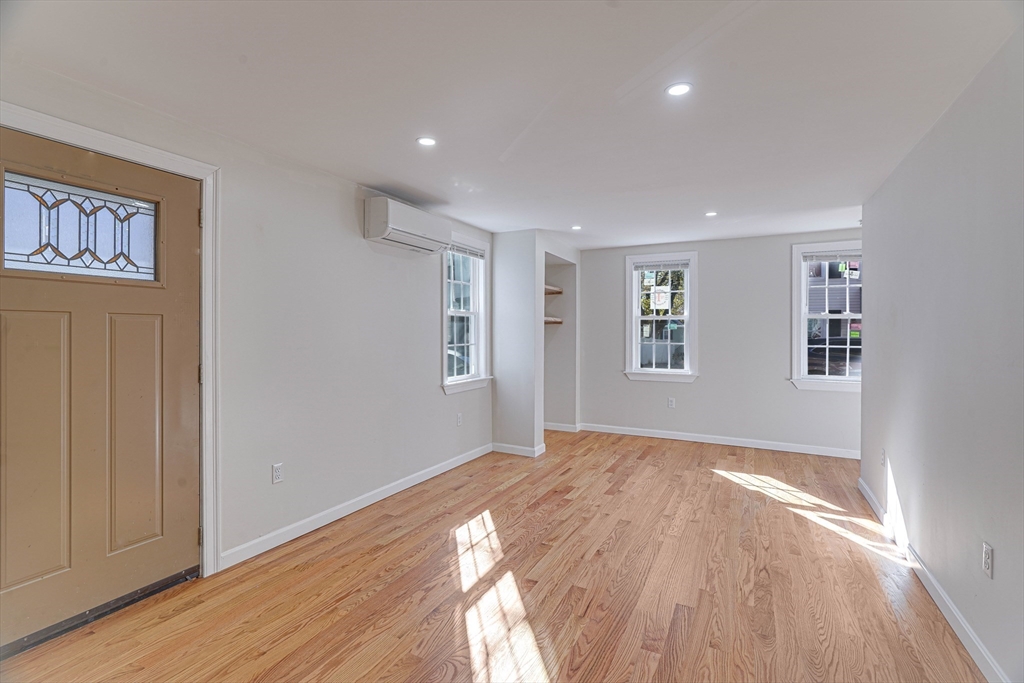 32 Northey Street, Unit 32 Salem, MA 01970 - Photo 3 of 29 a view of empty room with wooden floor and fan
