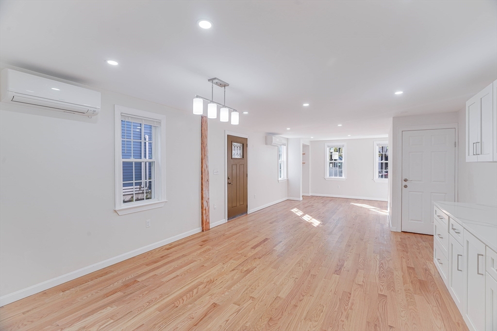 32 Northey Street, Unit 32 Salem, MA 01970 - Photo 9 of 29 a view of livingroom with hardwood floor and hallway