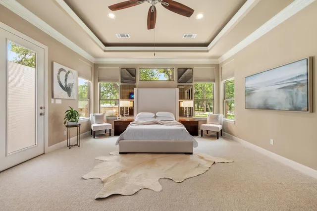 a bedroom with a large bed and a large window