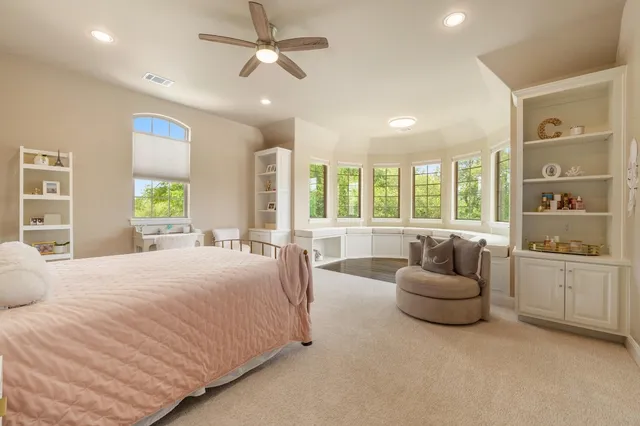 a bedroom with furniture and window