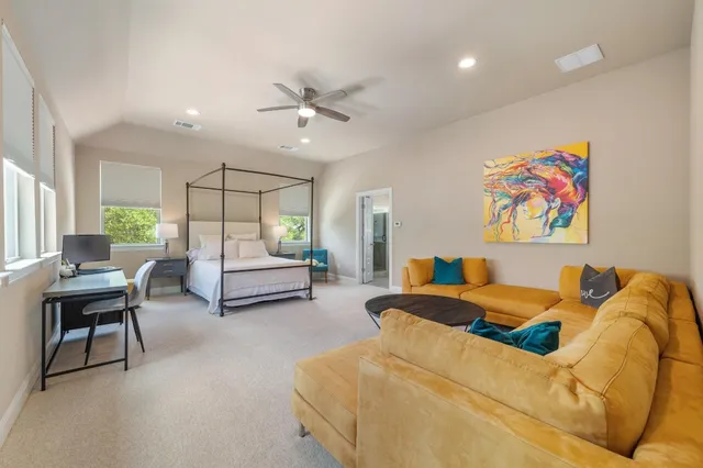 a bedroom with a bed and a couch